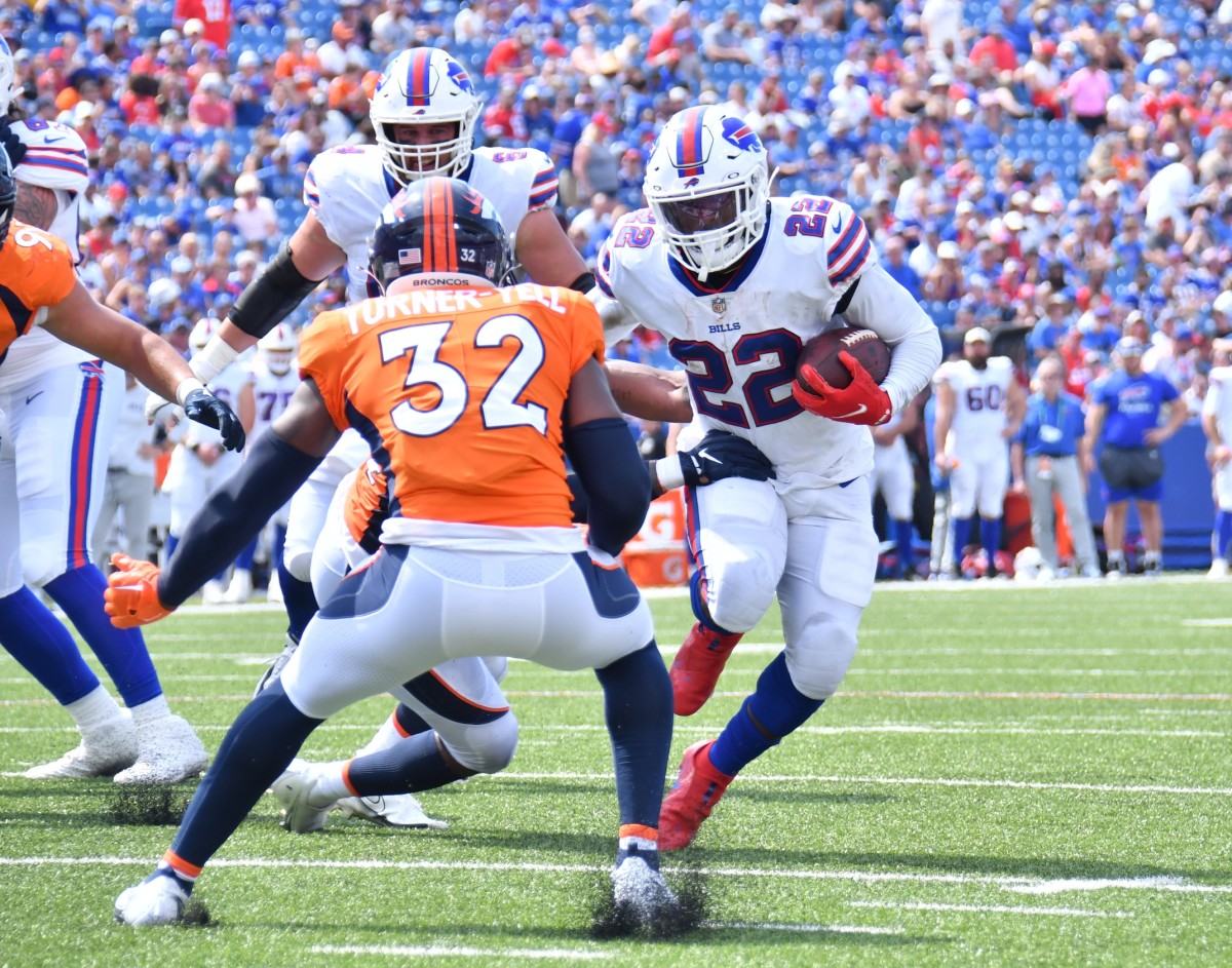 Buffalo Bills running back Duke Johnson (22) tries to move past Denver Broncos safety Delarrin Turner-Yell (32) near the goal line in the third quarter of a pre-season game at Highmark Stadium.