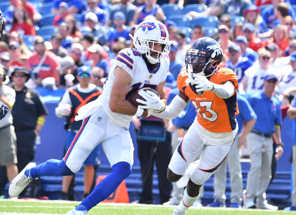 Buffalo Bills wide receiver Jake Kumerow (15) turns upfield after a catch as Denver Broncos cornerback Michael Ojemudia (13) looks to make a tackle in the second quarter of a pre-season game at Highmark Stadium.