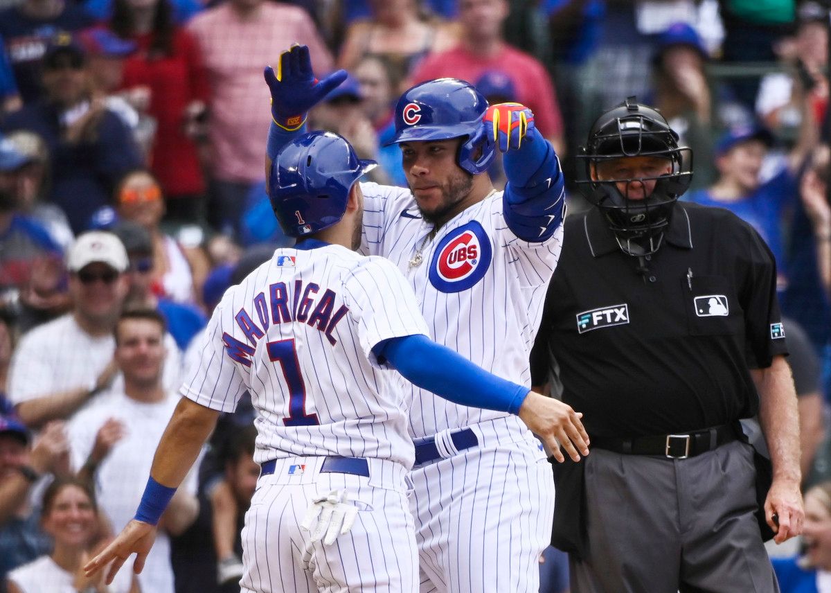 Nick Madrigal and Willson Contreras celebrate following a two-run home run.