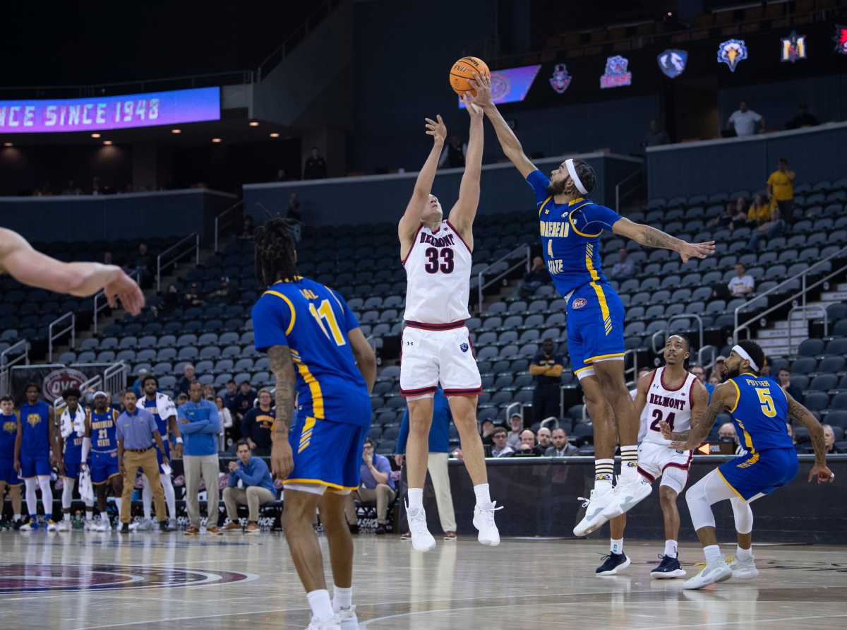 Belmont's Nick Muszynski (33) has his shot blocked by Morehead State's Johni Broome (4) with seconds left in their semifinal game of the 2022 Ohio Valley Conference Men's Basketball Championship at Ford Center in Evansville, Ind., March 4, 2022. Time ran out on Belmont and Morehead State won the game 53-51. Ds3422ovcmbksemi035