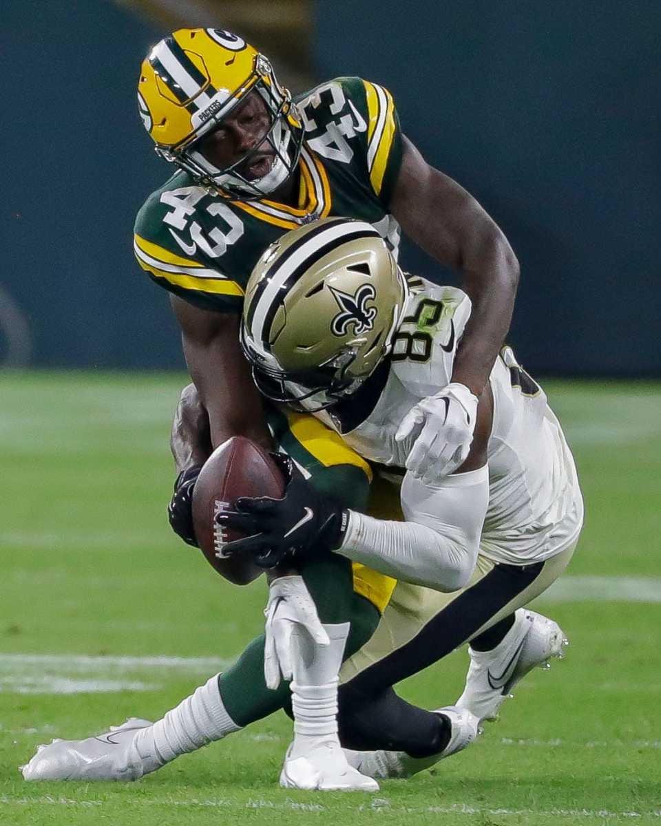 Packers cornerback Kiondre Thomas breaks up a pass to Kirk Merritt during the fourth quarter on Friday. (Tork Mason/USA Today Sports Images)