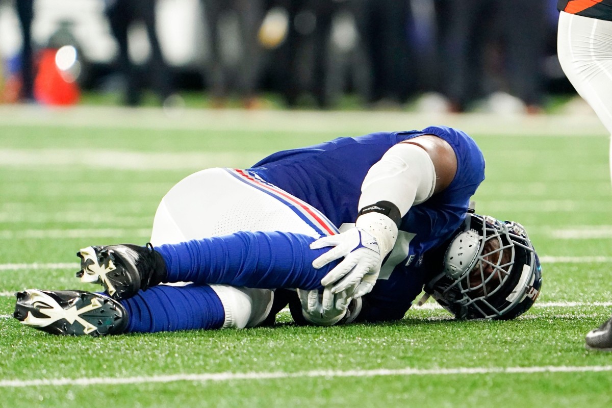 New York Giants defensive end Kayvon Thibodeaux (5) goes down during a preseason game against the Cincinnati Bengals at MetLife Stadium on August 21, 2022, in East Rutherford.