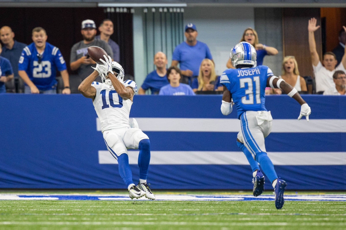 Aug 20, 2022; Indianapolis, Indiana, USA; Indianapolis Colts wide receiver Dezmon Patmon (10) catches a touchdown pass while Detroit Lions safety Kerby Joseph (31) defends in the second half at Lucas Oil Stadium. Mandatory Credit: Trevor Ruszkowski-USA TODAY Sports