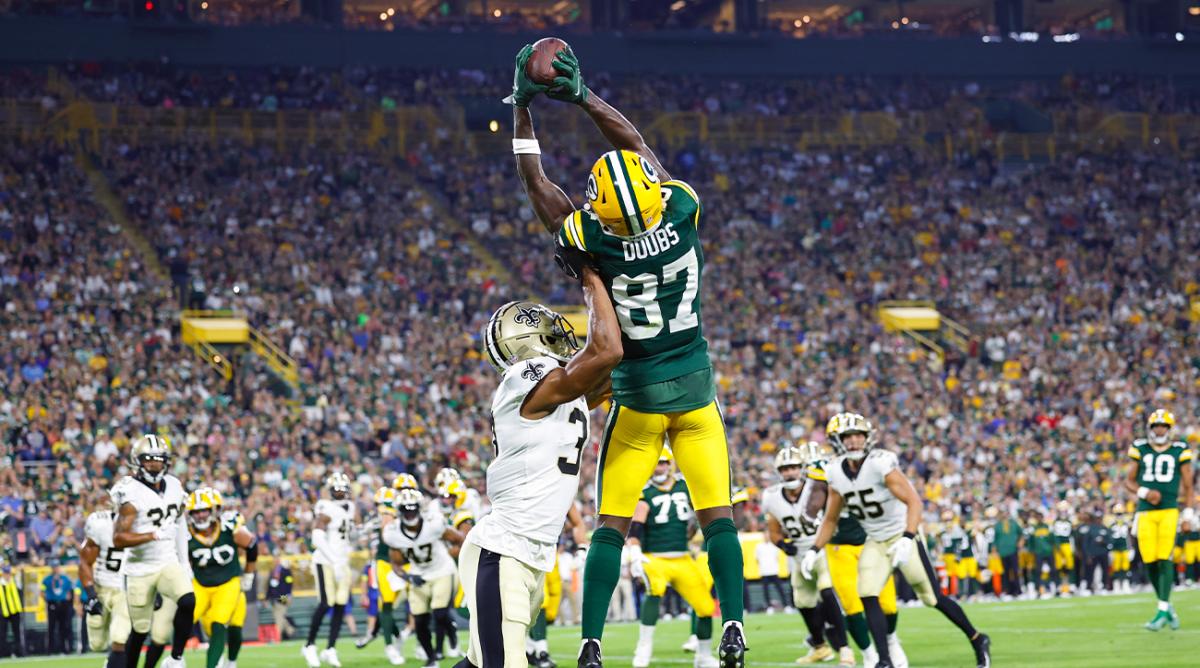 Aug 19, 2022; Green Bay, Wisconsin, USA; Green Bay Packers wide receiver Romeo Doubs (87) catches a pass to score a touchdown during the second quarter against the New Orleans Saints at Lambeau Field.