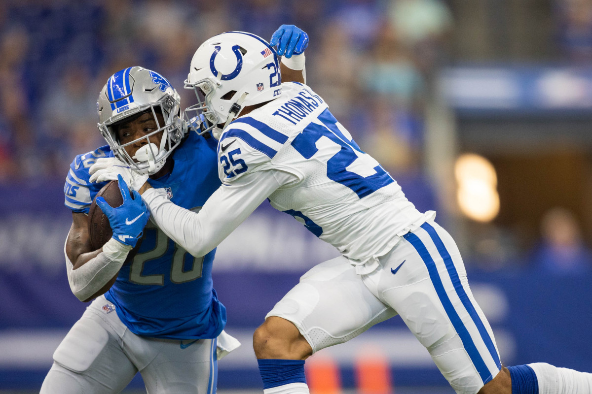 Aug 20, 2022; Indianapolis, Indiana, USA; Detroit Lions running back Jermar Jefferson (28) is tackled by Indianapolis Colts safety Rodney Thomas II (25) in the first quarter at Lucas Oil Stadium.