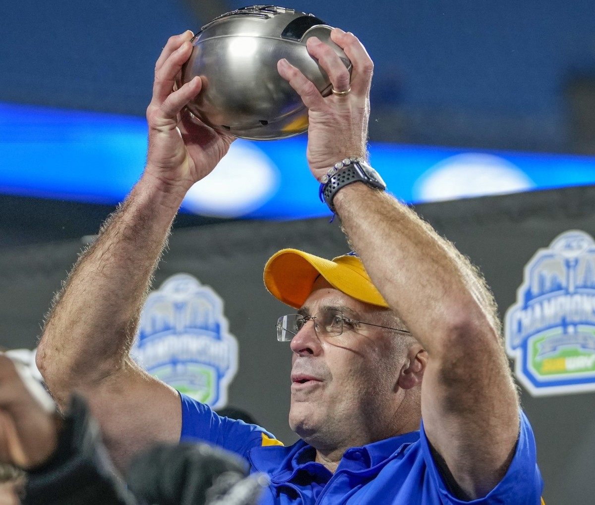 Dec 4, 2021; Charlotte, NC, USA; Pittsburgh Panthers head coach Pat Narduzzi holds up the trophy after defeating the Wake Forest Demon Deacons in the ACC championship game at Bank of America Stadium.