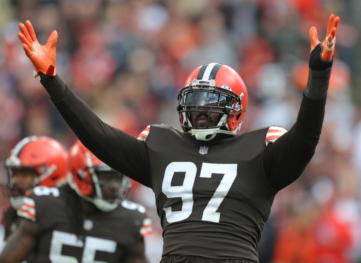 Cleveland Browns defensive tackle Malik Jackson (97) gets the crowd pumped up on third down during the first half of an NFL football game against the Arizona Cardinals at FirstEnergy Stadium, Sunday, Oct. 17, 2021, in Cleveland, Ohio. [Jeff Lange/Beacon Journal] Browns 19