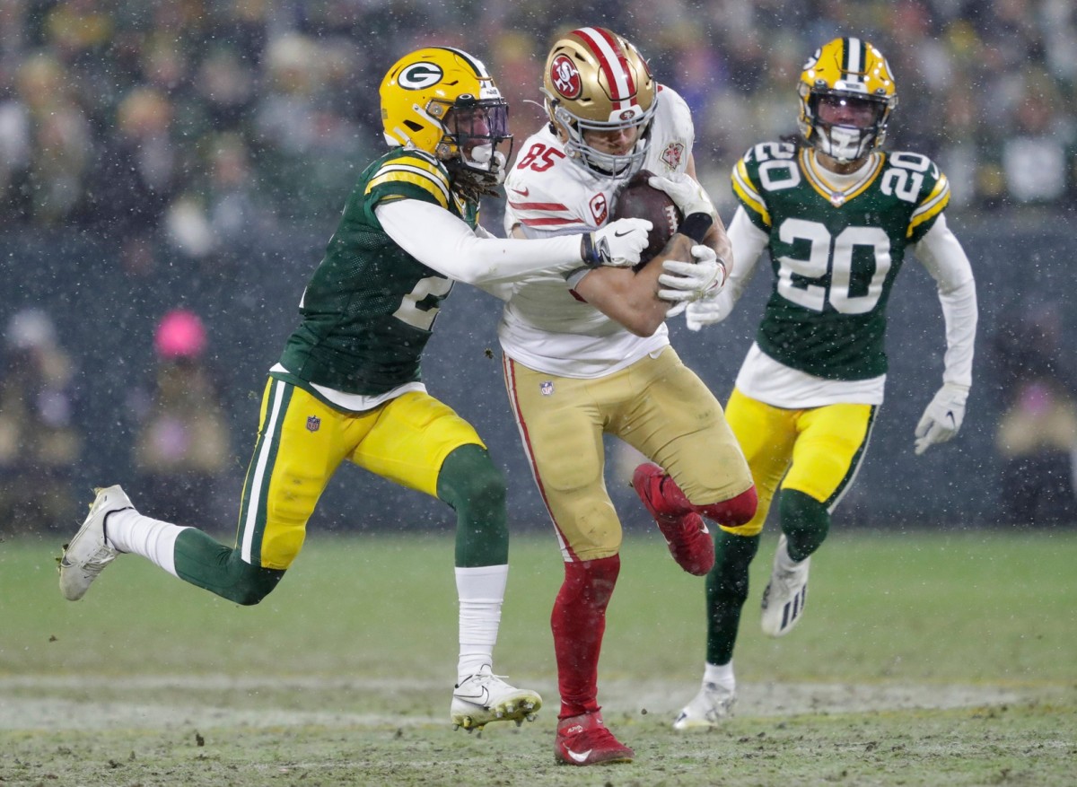 San Francisco 49ers tight end George Kittle (85) gets a long first down reception against Green Bay Packers cornerback Eric Stokes (21) and cornerback Kevin King (20) in the third quarter during their NFL divisional round football playoff game Saturday, Jan. 22, 2022, at Lambeau Field in Green Bay, Wis. Dan Powers/USA TODAY NETWORK-Wisconsin Apc Packvs49ers 0122221518djp