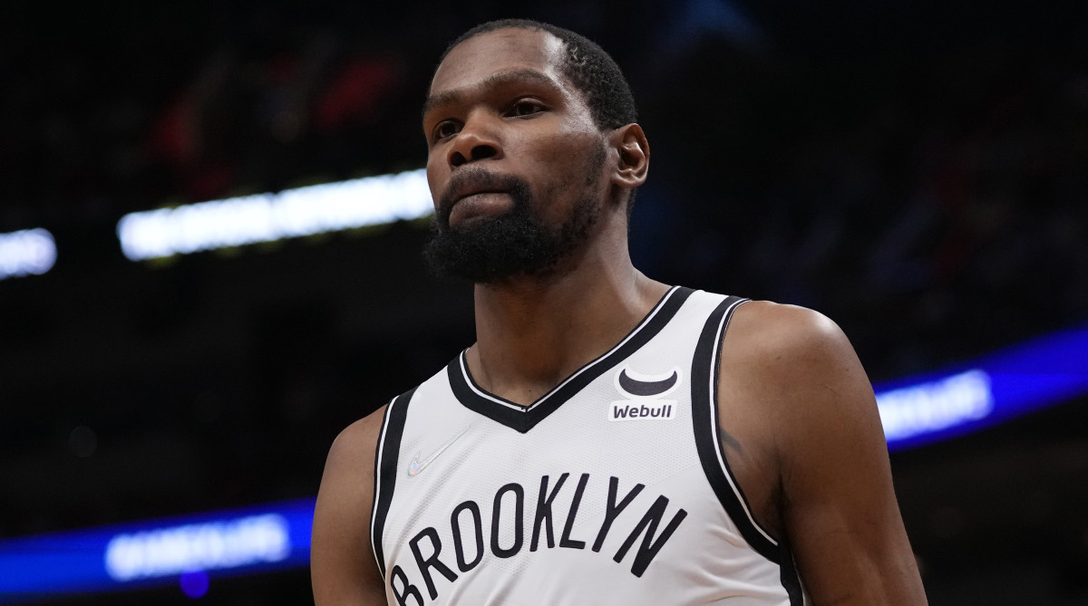 Nets forward Kevin Durant walks on the court during the second half against the Miami Heat.