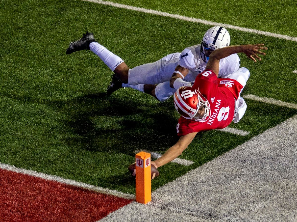 Michael Penix Jr. reaches to score a game-winning conversion run to beat Penn State in overtime 36-35.