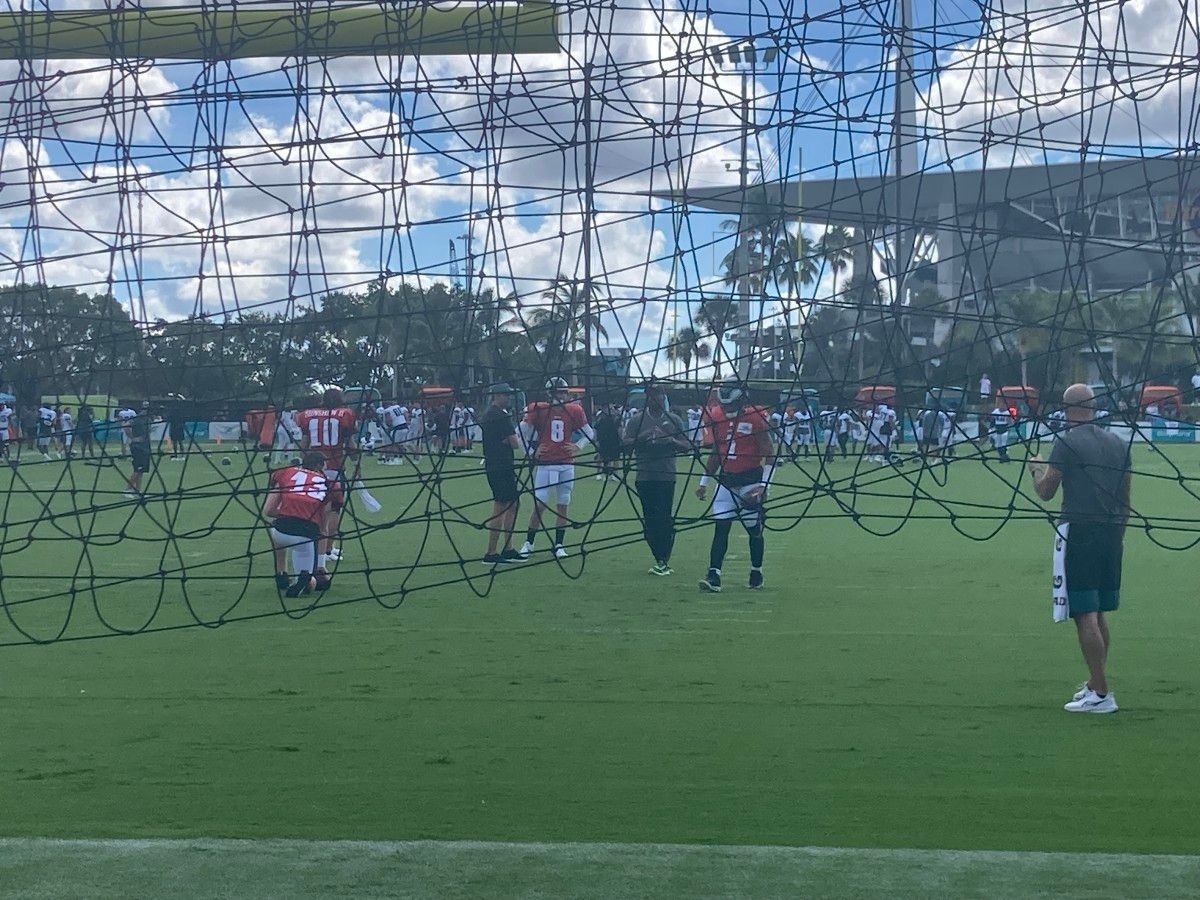 Jalen Hurts (1) gets ready for a drill during Wednesday's joint practice vs. the Dolphins