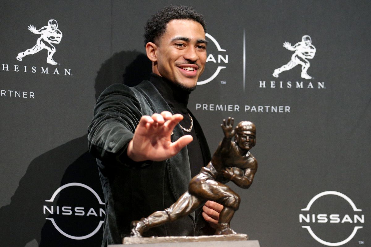 2021 Heisman winner Alabama quarterback Bryce Young poses for pictures with the trophy during a press conference at the New York Marriott Marquis in New York City.