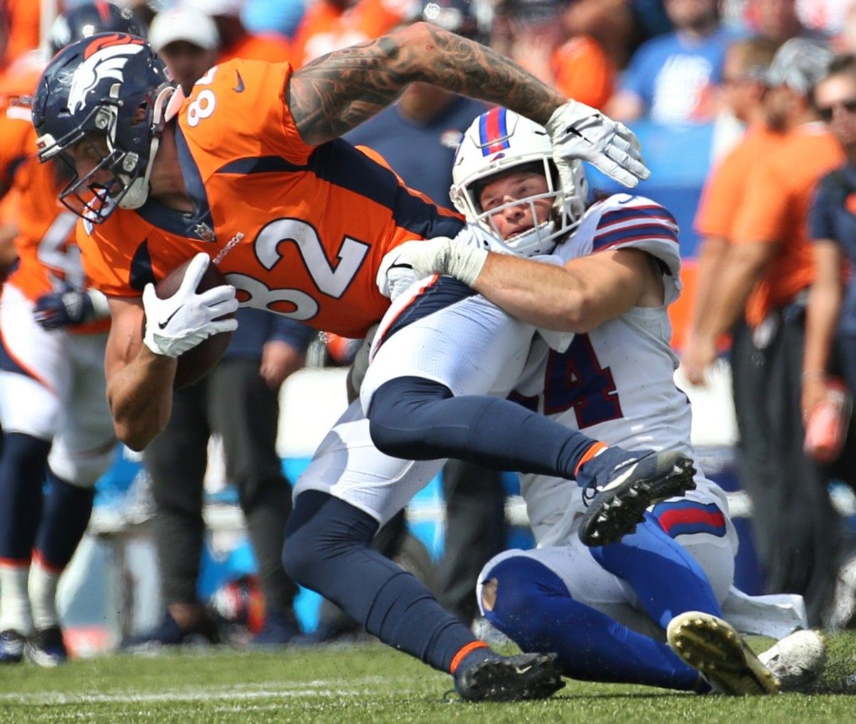 Bills linebacker Baylon Spector (54) hits Denver tight end Eric Saubert at the line for no gain in the second half of the Bills preseason game against Denver Saturday, Aug. 20, 2022 at Highmark Stadium. Sd 082022 Bills 72 Spts