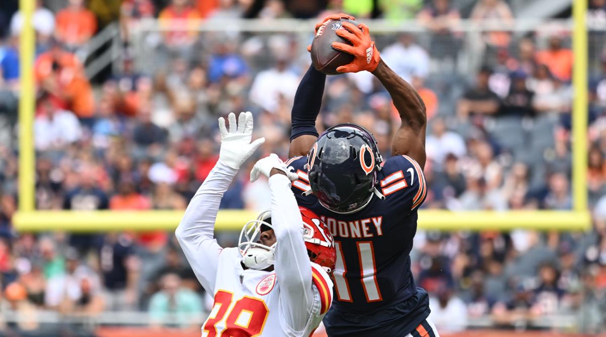 Aug 13, 2022; Chicago, Illinois, USA; Chicago Bears wide receiver Darnell Mooney (11) pulls in a 26-yard reception over Kansas City Chiefs cornerback L’Jarius Sneed (38) in the first quarter at Soldier Field.