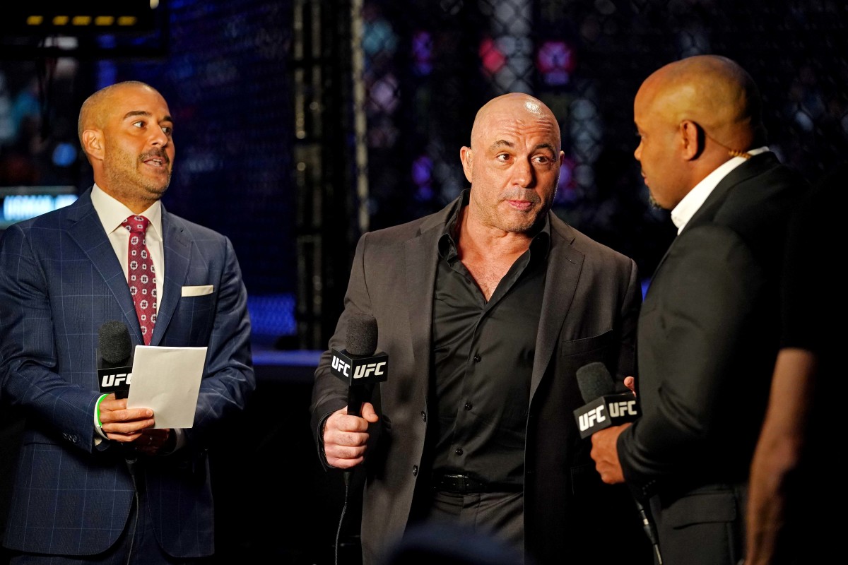 UFC ringside announcers Daniel Cormier, UFC ringside announcer Joe Rogan and UFC ringside announcer Jon Anik during UFC 261 at VyStar Veterans Memorial Arena.