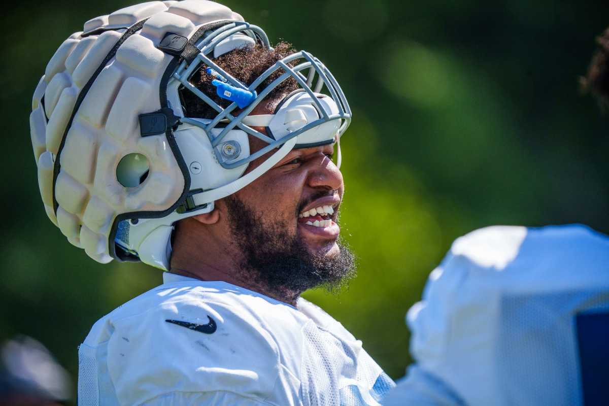 Indianapolis Colts defensive tackle Grover Stewart (90) laughs with teammates Thursday, Aug. 18, 2022, before a joint training camp with the Detroit Lions at the Grand Park Sports Campus in Westfield, Indiana. Colts Lions Training Camp Photos 2022
