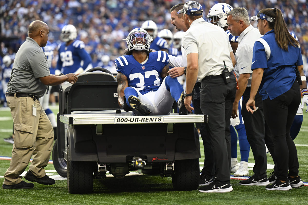 Aug 27, 2022; Indianapolis, Indiana, USA; Indianapolis Colts safety Armani Watts (33) is yells in pain with an injury early in the first quarter during the game against the Tampa Bay Buccaneers at Lucas Oil Stadium.