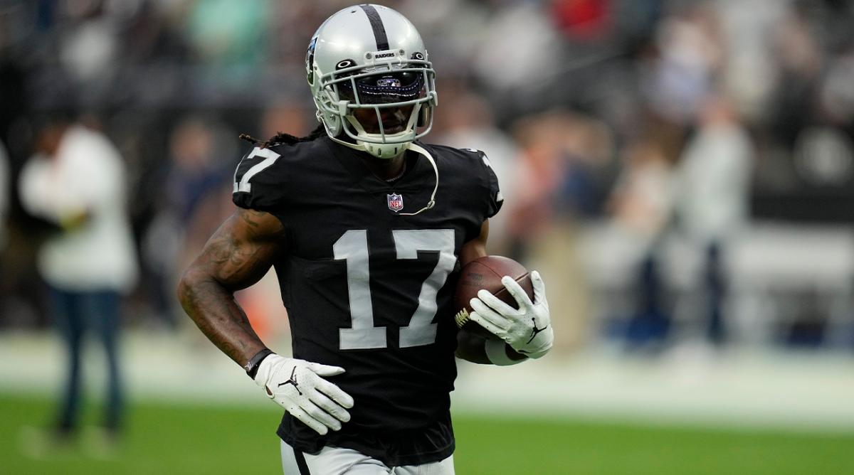 Las Vegas Raiders wide receiver Davante Adams (17) warms up before an NFL preseason football game against the New England Patriots, Friday, Aug. 26, 2022, in Las Vegas.