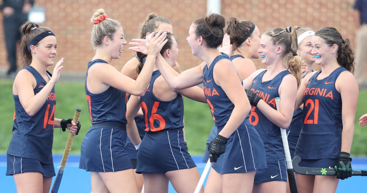 The Virginia field hockey team celebrates after its win.