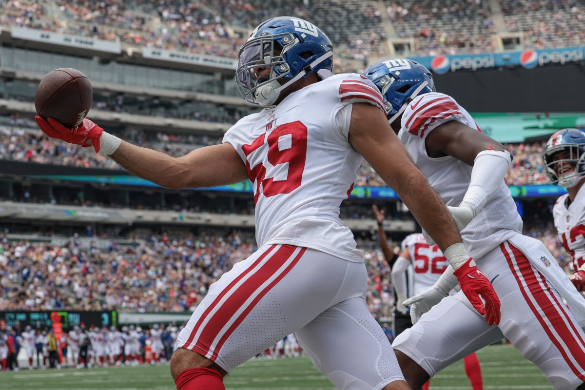 Aug 28, 2022; East Rutherford, New Jersey, USA; New York Giants linebacker Austin Calitro (59) celebrates his interception return for a touchdown during the first half against the New York Jets at MetLife Stadium.
