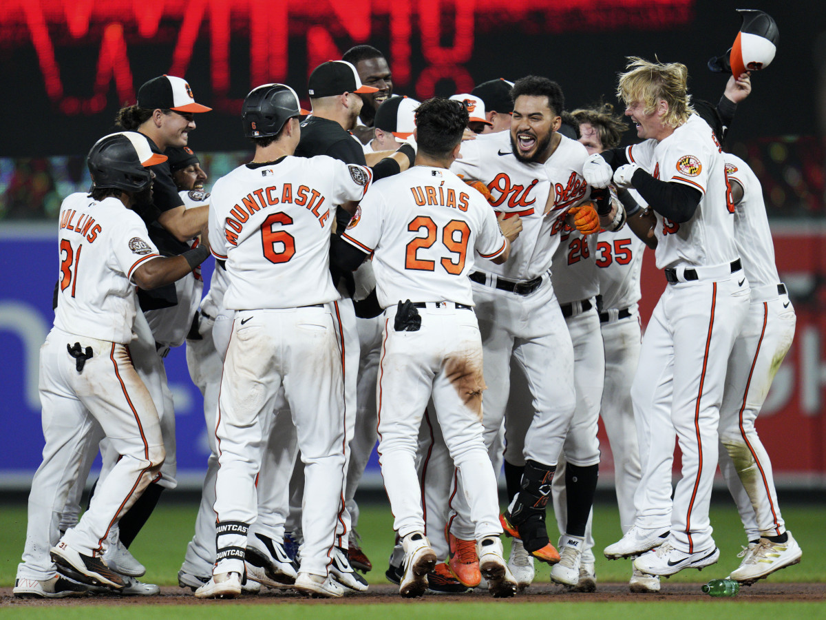Aug 25, 2022; Baltimore, Maryland, USA;  The Baltimore Orioles celebrate designated hitter Anthony Santander’s (25) walk-off hit against the Chicago White Sox at Oriole Park at Camden Yards.