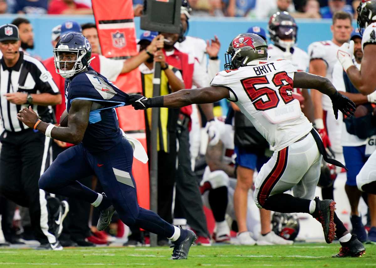 Tennessee Titans quarterback Malik Willis (7) rushes for a first down past Tampa Bay Buccaneers linebacker K.J. Britt (52) during the second quarter of a preseason game at Nissan Stadium Saturday, Aug. 20, 2022, in Nashville, Tenn. Nfl Tampa Bay Buccaneers At Tennessee Titans