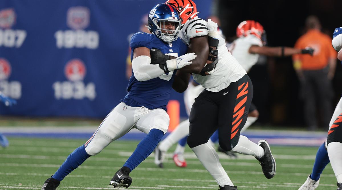 Aug 21, 2022; East Rutherford, New Jersey, USA; New York Giants defensive end Kayvon Thibodeaux (5) rushes the passer as New York Giants guard Jamil Douglas (77) blocks during the first half at MetLife Stadium.