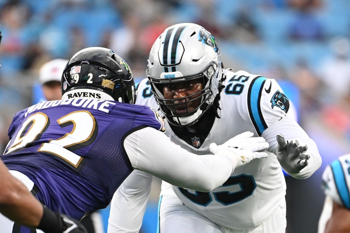 Carolina Panthers offensive guard Dennis Daley (65) at the line against Baltimore Ravens defensive tackle Justin Madubuike (92) in the first quarter at Bank of America Stadium.