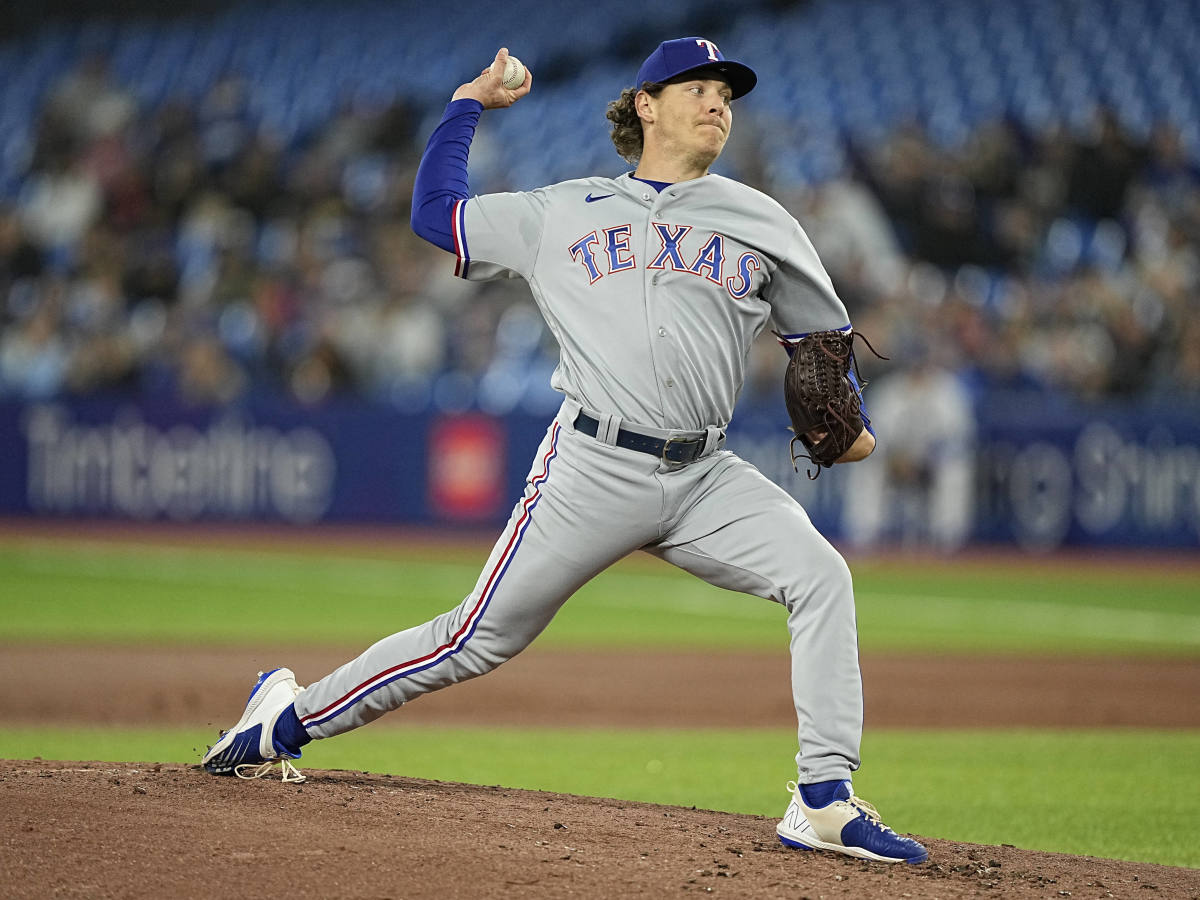 Spencer Howard toes the rubber for the Texas Rangers in an April 10 game versus the Blue Jays. He would go on to allow four home runs in three innings of work.