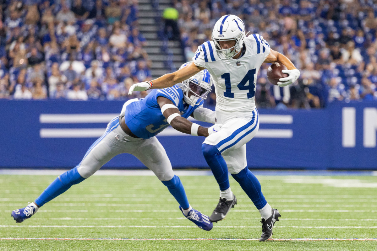 Aug 20, 2022; Indianapolis, Indiana, USA; Indianapolis Colts wide receiver Alec Pierce (14) catches the ball while Detroit Lions safety Kerby Joseph (31) defends in the first quarter at Lucas Oil Stadium. Mandatory Credit: Trevor Ruszkowski-USA TODAY Sports