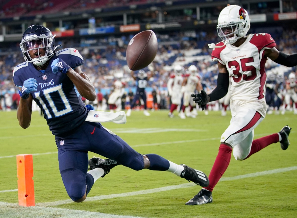 Tennessee Titans wide receiver Dez Fitzpatrick (10) drops a pass in the end zone as he is defended by Arizona Cardinals cornerback Christian Matthew (35) during the fourth quarter of an NFL preseason game at Nissan Stadium Saturday, Aug. 27, 2022, in Nashville, Tenn.