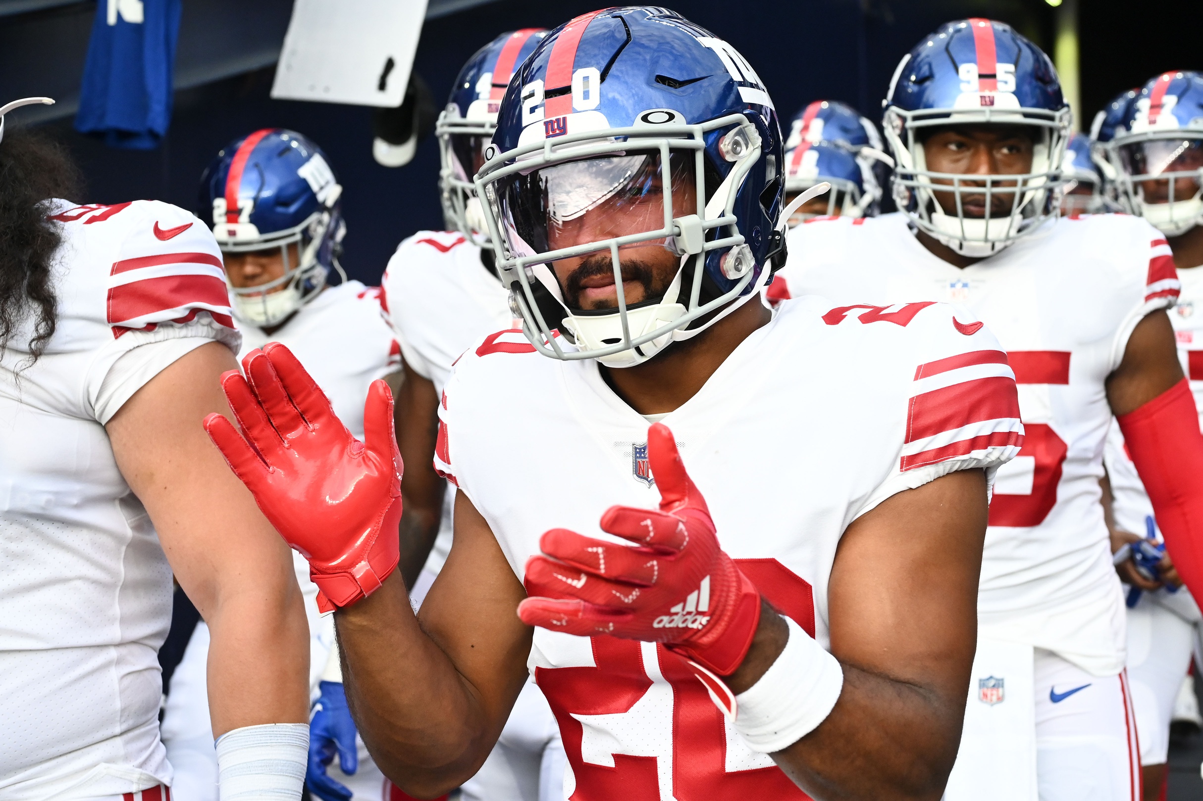 Aug 11, 2022; Foxborough, Massachusetts, USA; New York Giants safety Julian Love (20) walks onto the field before a preseason game against the New England Patriots at Gillette Stadium.