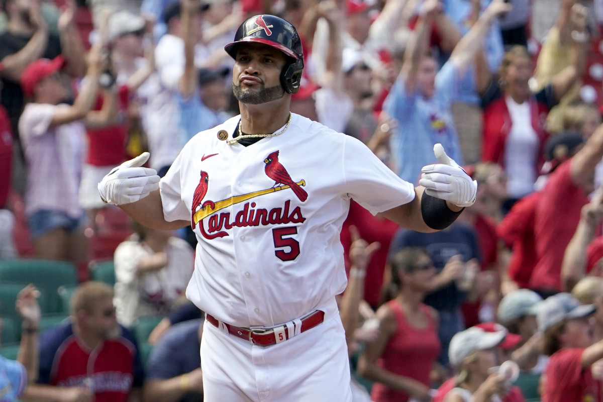 St. Louis Cardinals’ Albert Pujols celebrates after hitting a three-run home run during the eighth inning of a baseball game against the Milwaukee Brewers Sunday, Aug. 14, 2022, in St. Louis.