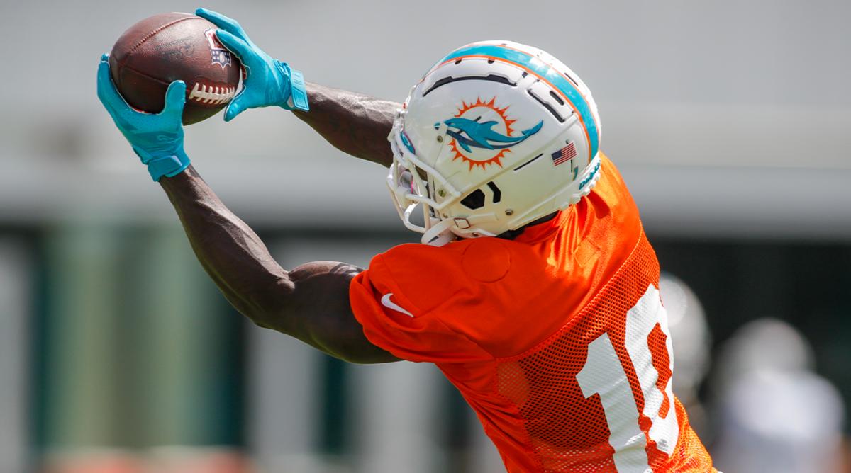 Aug 1, 2022; Miami Gardens, Florida, US; Miami Dolphins wide receiver Tyreek Hill (10) catches the football during training camp at Baptist Health Training Complex.