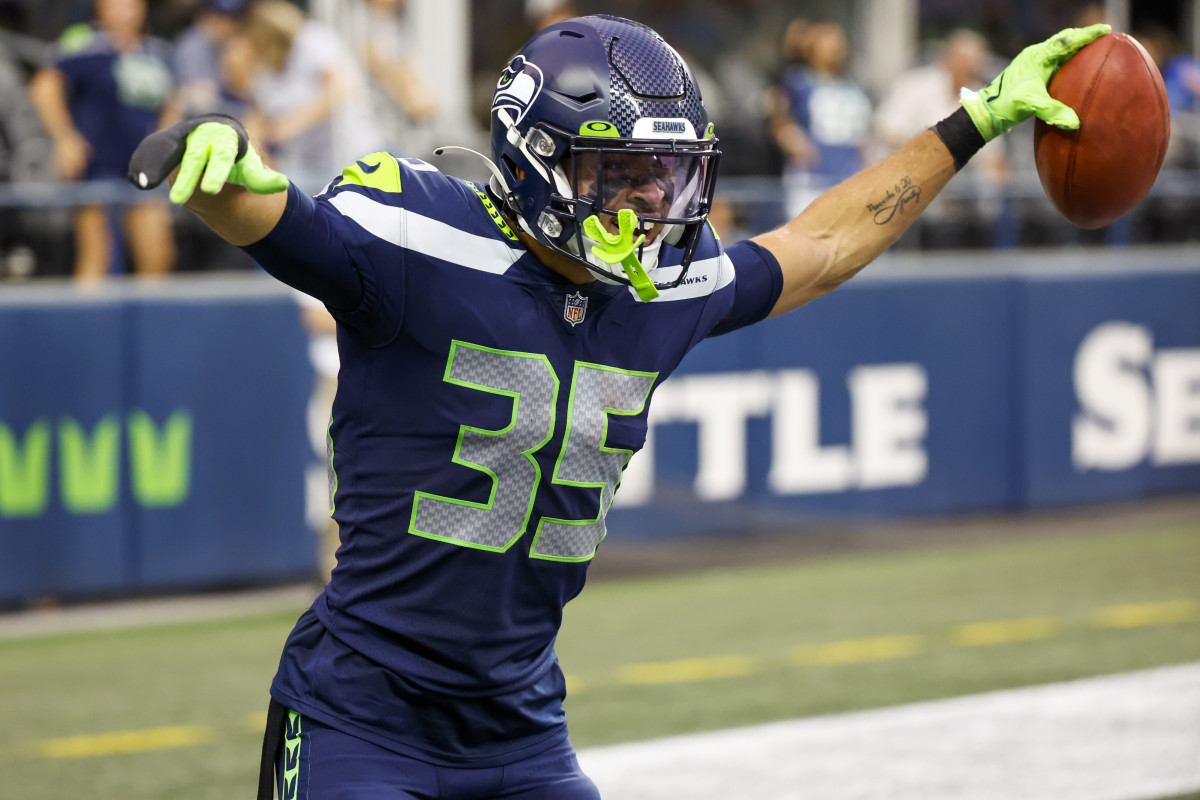 Seattle Seahawks safety Joey Blount (35) celebrates after recovering an on-side kick against the Chicago Bears during the fourth quarter at Lumen Field.
