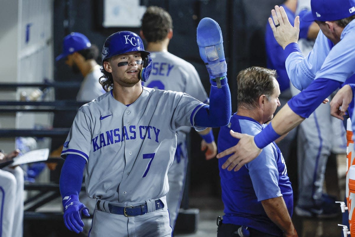 Aug 30, 2022; Chicago, Illinois, USA; Kansas City Royals shortstop Bobby Witt Jr. (7) celebrates with teammates after scoring against the Chicago White Sox during the fifth inning at Guaranteed Rate Field. Mandatory Credit: Kamil Krzaczynski-USA TODAY Sports