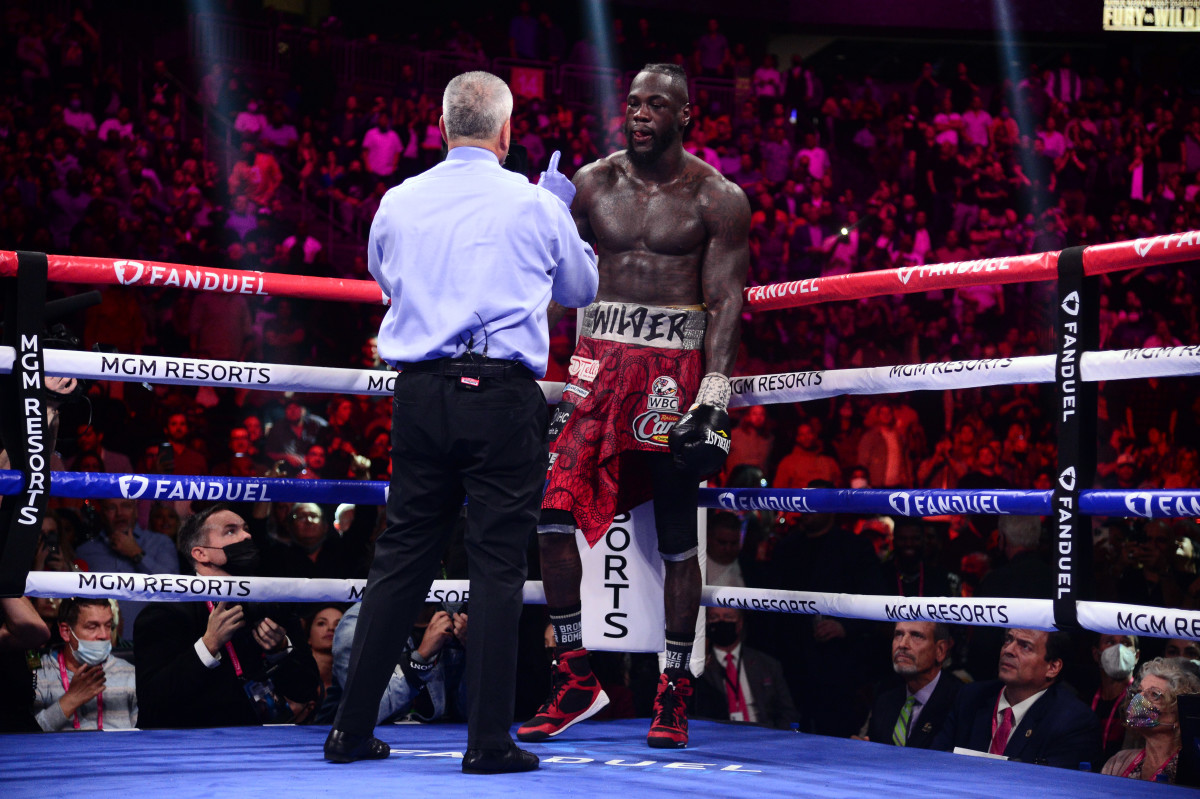 Deontay Wilder gets up after being knocked down by Tyson Fury (not pictured) during their WBC/Lineal heavyweight championship boxing match at T-Mobile Arena.