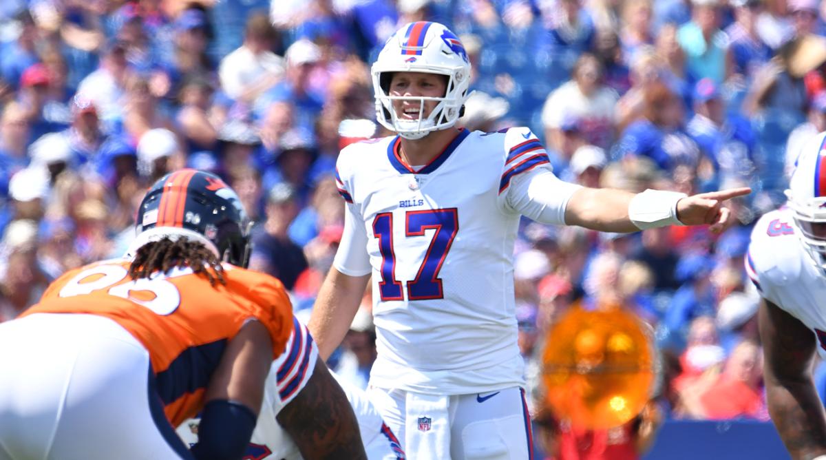 Aug 20, 2022; Orchard Park, New York, USA; Buffalo Bills quarterback Josh Allen (17) at the line of scrimmage in the first quarter of a pre-season game against the Denver Broncos at Highmark Stadium.