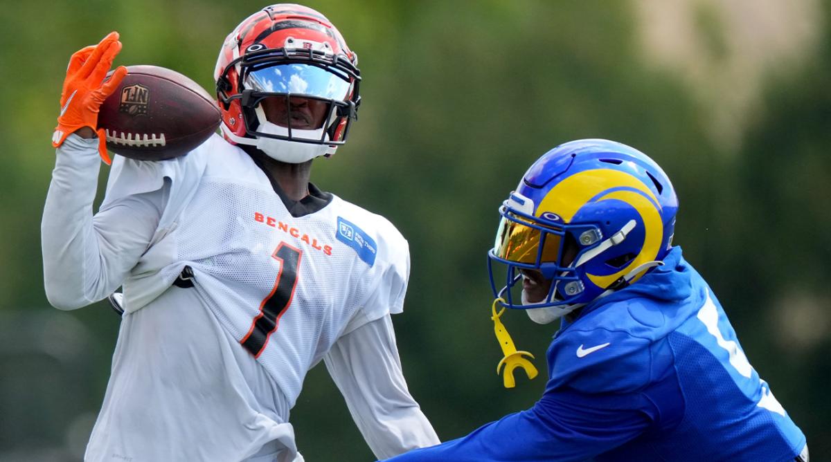 Cincinnati Bengals wide receiver Ja’Marr Chase (1) completes a one-handed catch as Los Angeles Rams cornerback Jalen Ramsey (5) defends during a joint practice, Wednesday, Aug. 24, 2022, at the Paycor Stadium practice fields in Cincinnati.