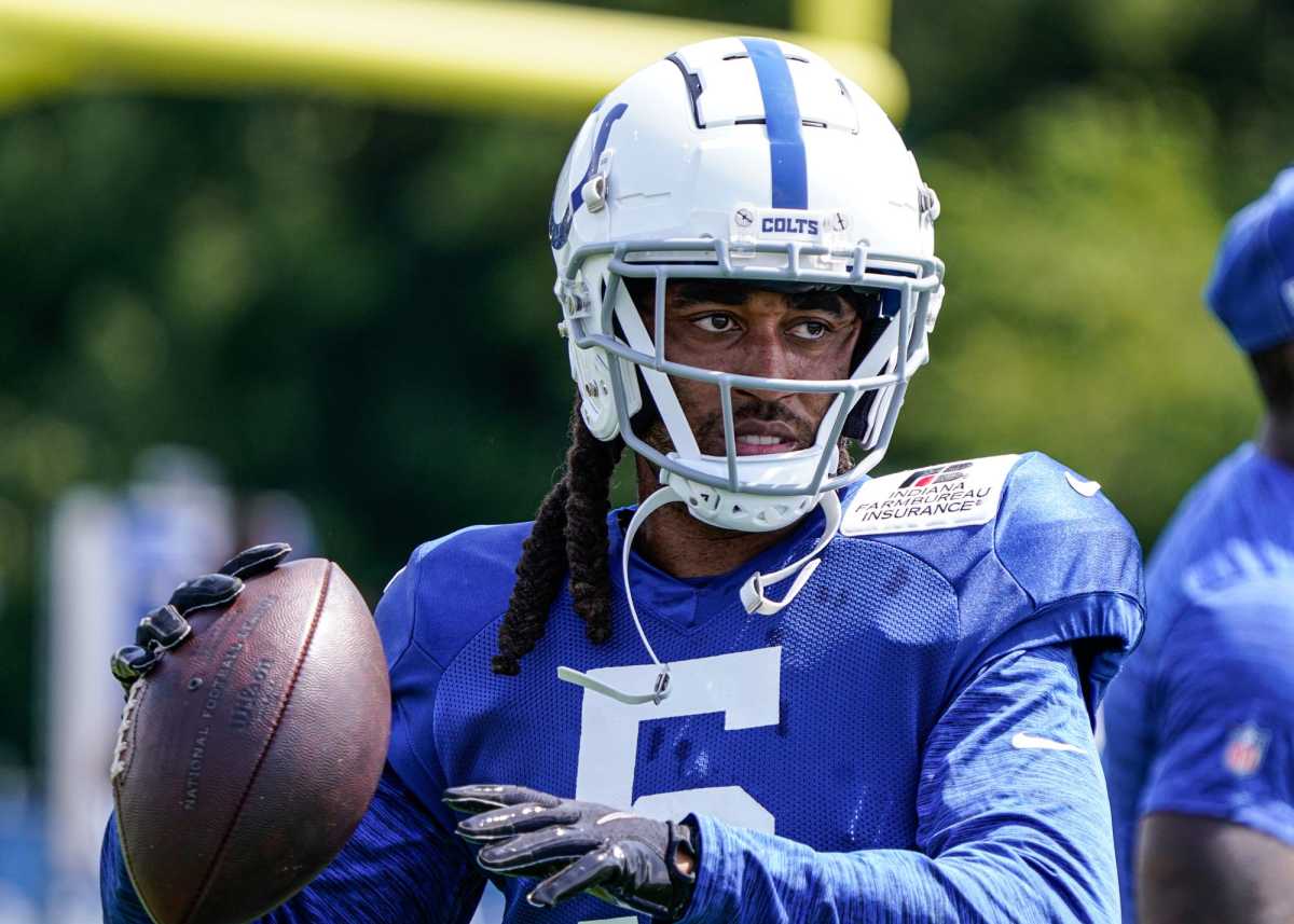 The Indianapolis Colts Stephon Gilmore(5) tosses a football around with teammates in between drills during Colts Camp on Monday, August 8, 2022, at Grand Park in Westfield Ind.