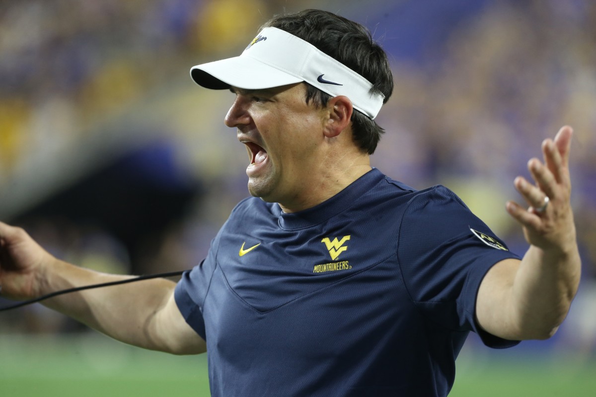 Sep 1, 2022; Pittsburgh, Pennsylvania, USA; West Virginia Mountaineers head coach Neal Brown reacts on the sidelines against the Pittsburgh Panthers during the second quarter at Acrisure Stadium.