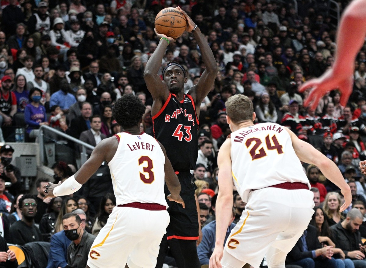 Toronto Raptors forward Pascal Siakam (43) shoots the ball over Cleveland Cavaliers forward Lauri Markkanen (24) and guard Caris LeVert (3) in the second half at Scotiabank Arena