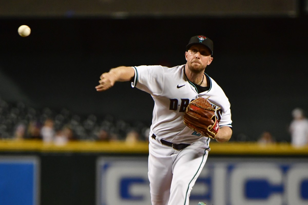 Merrill Kelly pitches in the 3rd inning against the Milwaukee Brewers