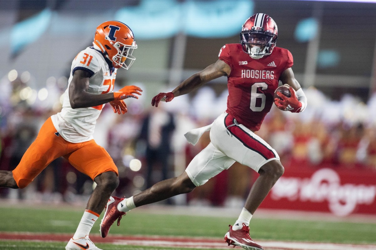 Indiana Hoosiers wide receiver Cam Camper (6) runs with the ball after a catch while Illinois Fighting Illini defensive back Devon Witherspoon (31) defends in the second quarter at Memorial Stadium.