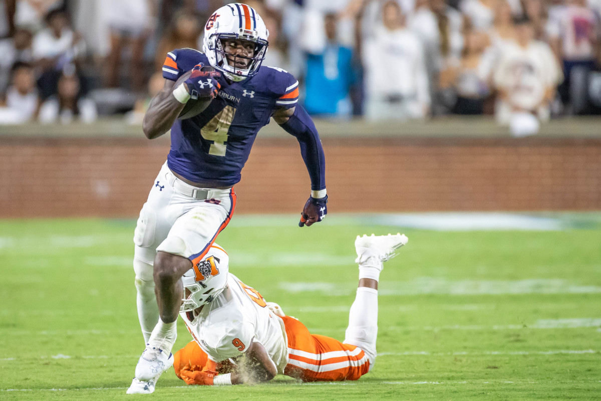 Auburn Tigers running back Tank Bigsby (4) breaks the tackle and carries for a first down during the game between the Mercer Bears and the Auburn Tigers at Jordan-Hare Stadium on Sept. 3, 2022.