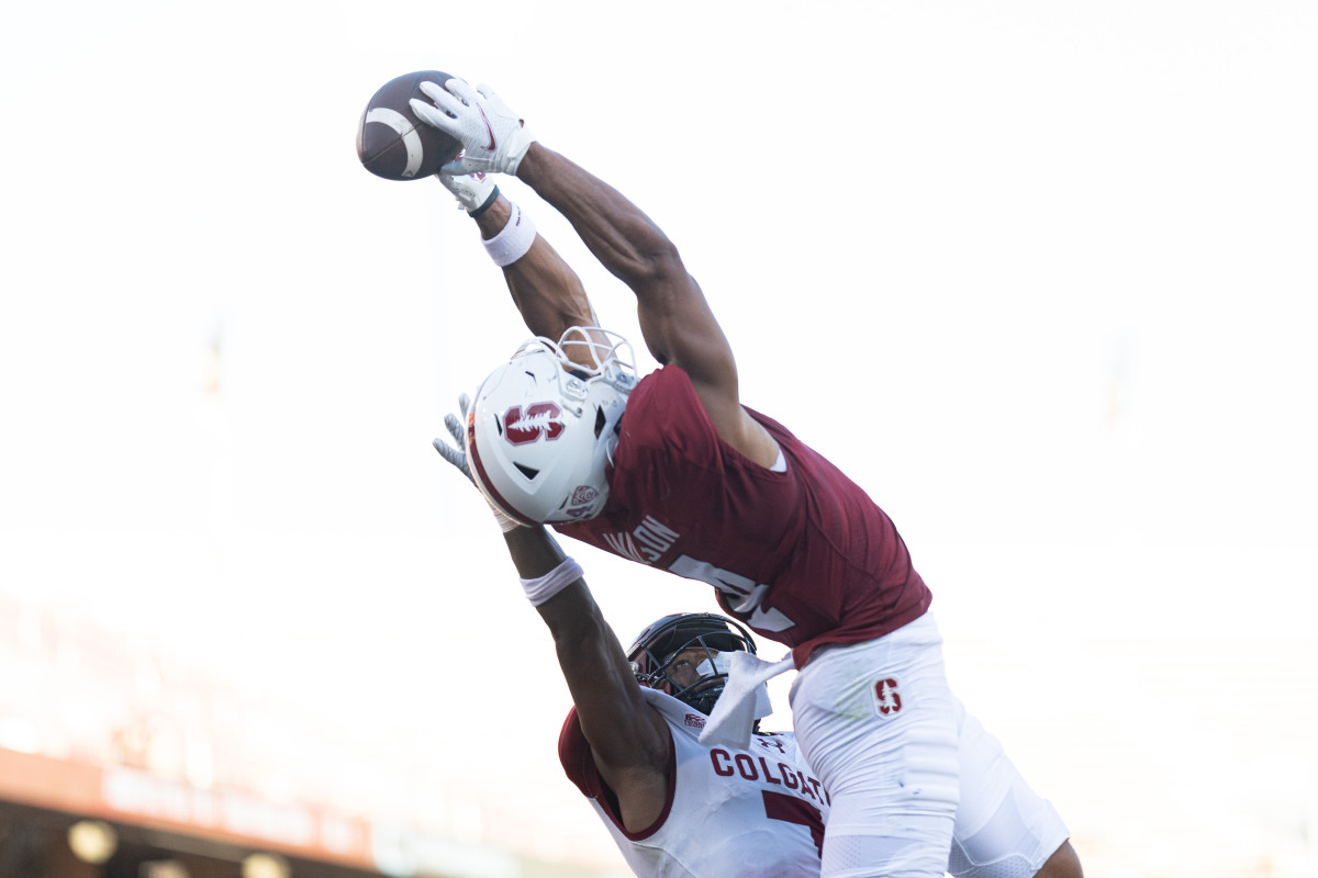 Stanford Cardinal wide receiver Michael Wilson (4) catches the ball for a touchdown over Colgate Raiders defensive back Asauni Allen (7) during the second quarter at Stanford Stadium.