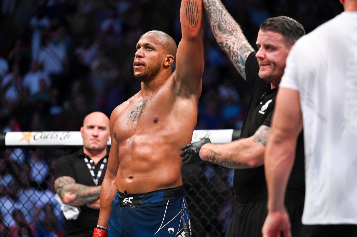 Ciryl Gane (red gloves) defeats Tai Tuivasa (blue gloves) during UFC Fight Night at Accor Arena.