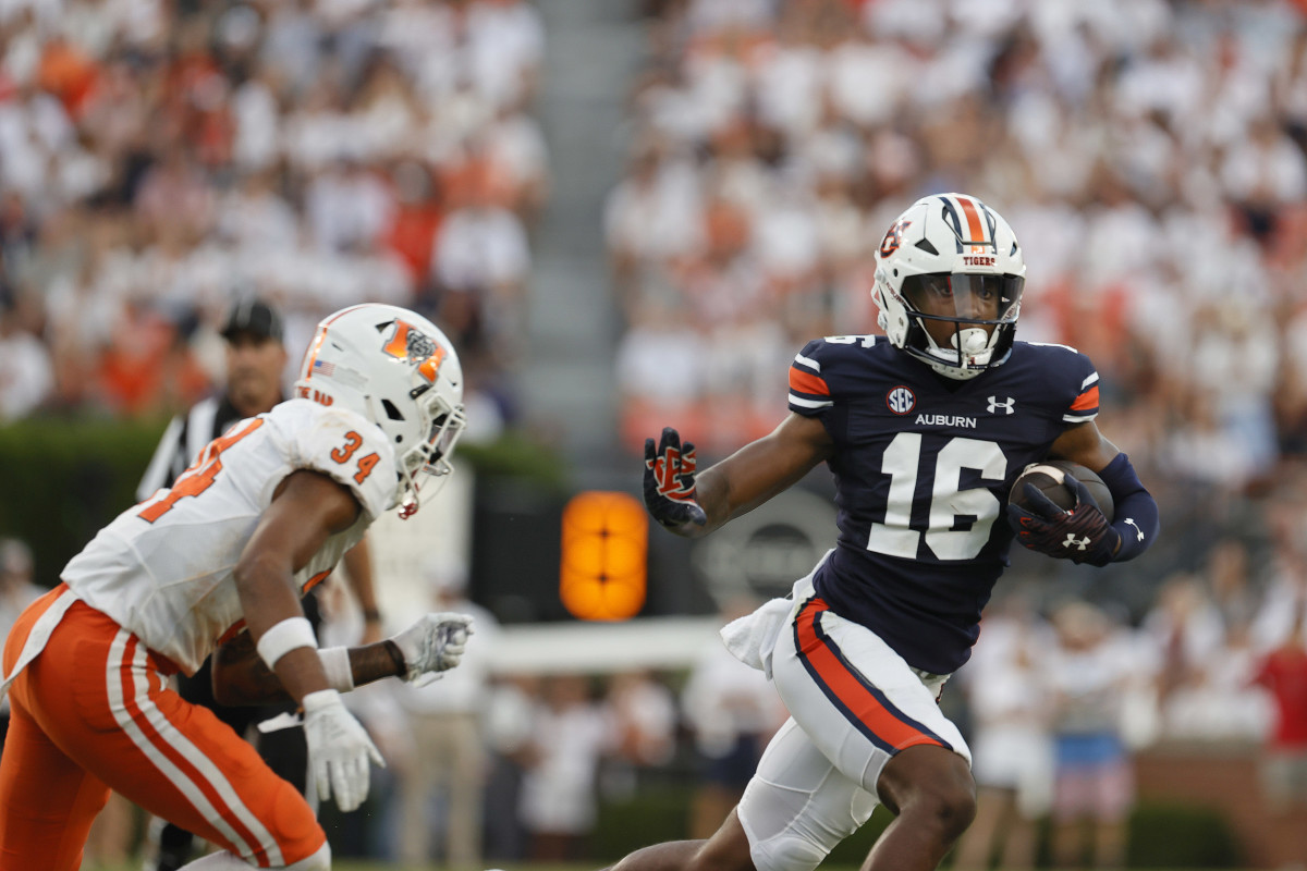 Sep 3, 2022; Auburn, Alabama, USA; Auburn Tigers wide receiver Malcolm Johnson Jr. (16) carries as Mercer Bears safety Myles Redding (34) closes in during the first quarter at Jordan-Hare Stadium. Mandatory Credit: John Reed-USA TODAY Sports