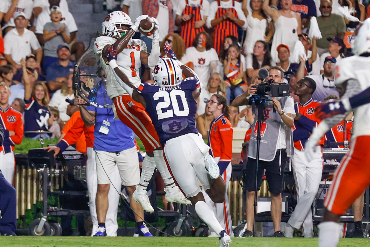 Mercer Bears wide receiver Devron Harper (1) goes up over Auburn Tigers safety Cayden Bridges (20) for the Bears first score of the game.  Mercer Bears and the Auburn Tigers at Jordan-Hare Stadium on Sept. 3, 2022.