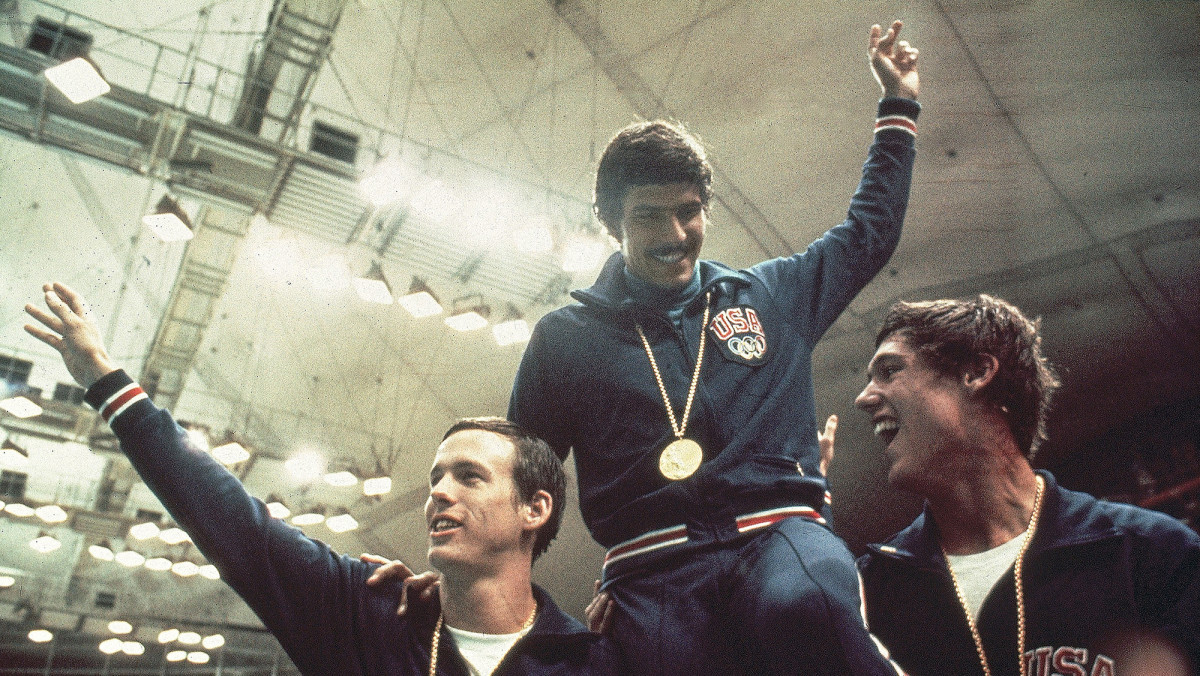 Spitz was hoisted aloft by his teammates after winning his seventh gold.